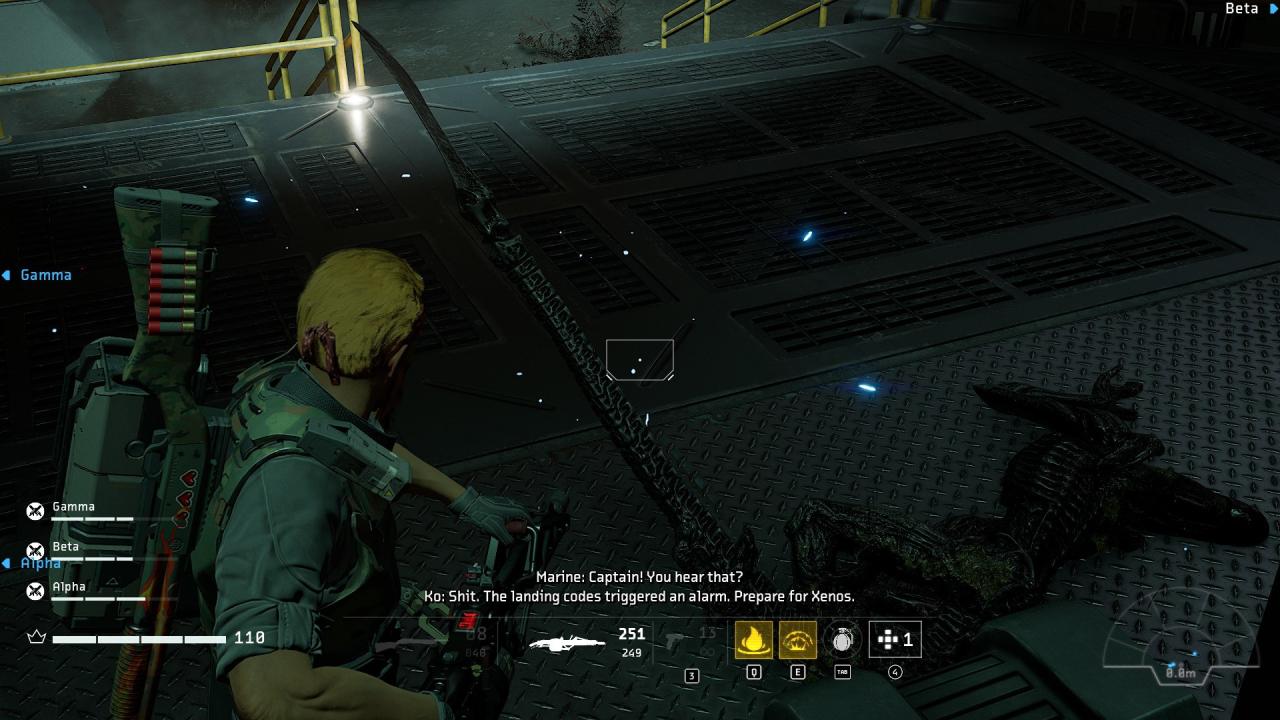 Aliens: Fireteam Elite's marine inspects dead Xenomorph