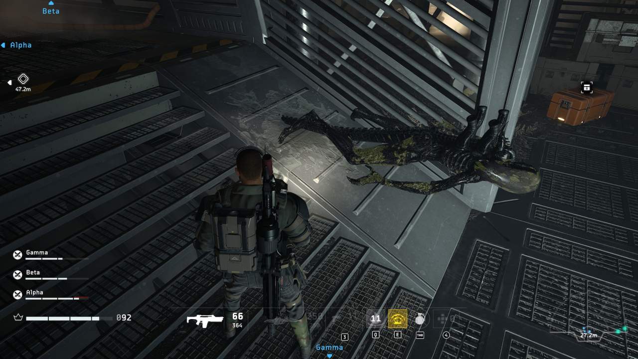 Aliens: Fireteam Elite's marine looks at Xenomorph