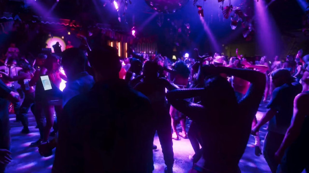 Grand Theft Auto VI crowd dancing inside strip club